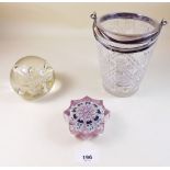 A cut glass ice bucket with silver plated rim and two paperweights