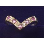 A 9 carat gold ruby and chip diamond ring, size L