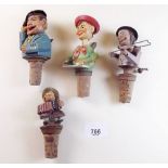 Four painted wood novelty bottle stoppers