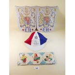 A set of vintage table mats, 1953 Coronation cap (as new) and two Royal Coats of Arms