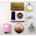 A group of compacts and perfumes