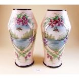 A pair of Victorian floral painted glass vases