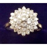 A 9 carat gold diamond set cluster ring - size N