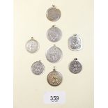 Eight silver St Christopher medals