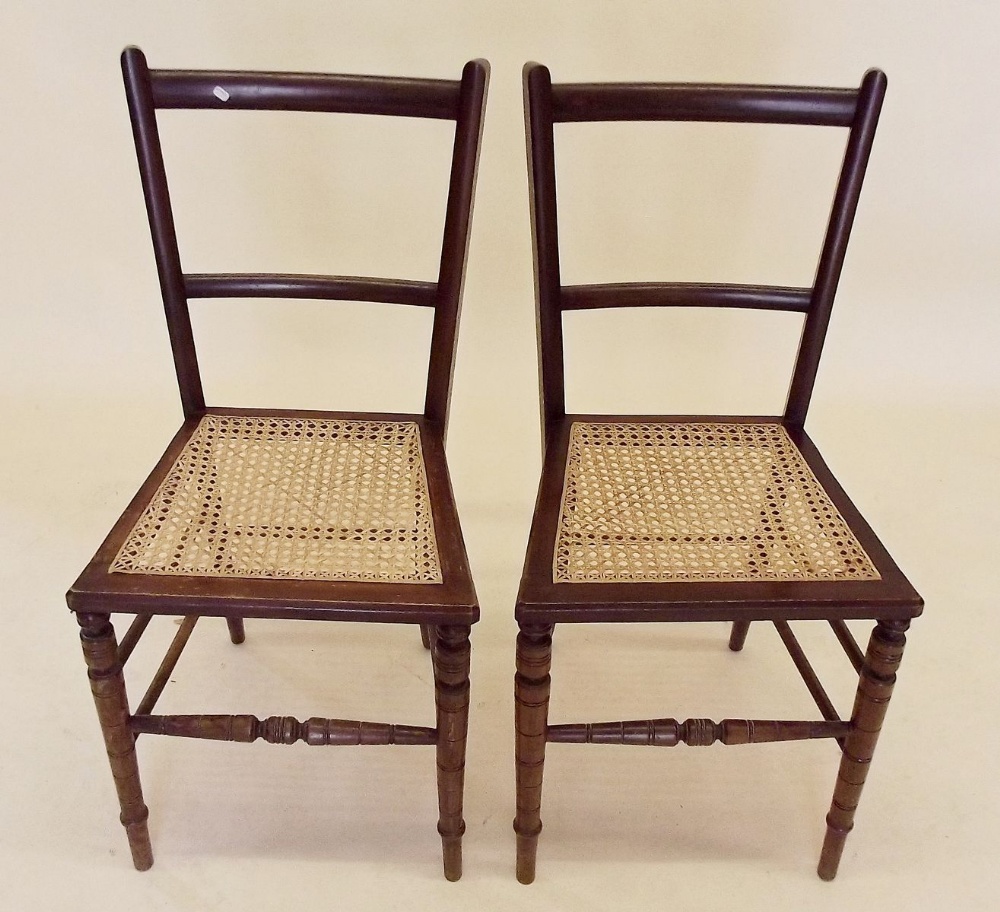 A pair of Edwardian cane seated bedroom chairs