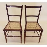 A pair of Edwardian cane seated bedroom chairs