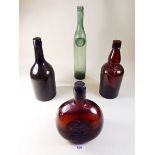 Four antique bottles of various shapes