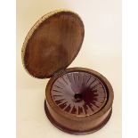 A small Victorian mahogany circular stool with pottery spittoon within