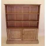 A set of old open pine shelves with cupboard under 126cm wide