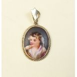 A small Victorian 9 carat gold framed porcelain pendant painted portrait of a boy, Chester 1889