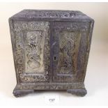 A Japanese antimony two door table top cabinet with chrysanthemum decoration enclosing four