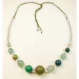 A jade and rock crystal string of beads