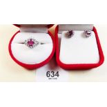 A matching silver ring and earrings set rubies and cubic zirconium - with certificates