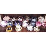 A collection of seventeen Caithness paperweights