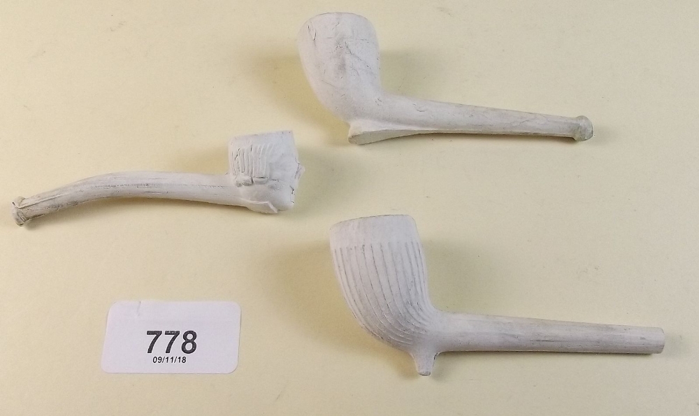 Three Victorian clay pipes