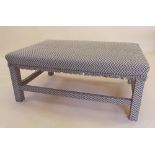 A large rectangular upholstered stool