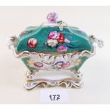 A Staffordshire porcelain inkwell hand painted floral decoration on a green ground