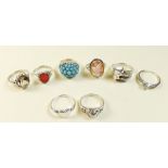 Seven silver rings and a turquoise set gilt white metal ring