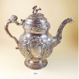 An early 19th century Irish silver Regimental coffee pot with flower finial over bombe form body