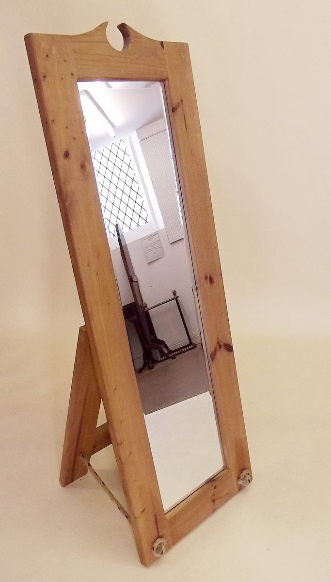 A large rustic styled pine cheval mirror