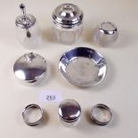 Six various silver and glass dressing table items and two white metal napkin rings