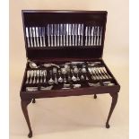 A silver Kings Pattern cutlery set in fitted cabinet with rise top