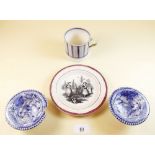 An early 19th century pottery mug, a creamware alphabet plate a/f, and two blue and white floral