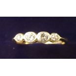 An 18 carat gold four stone diamond set ring - size I