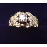 A 14 carat gold diamond set ring - the centre stone just under 1/2 carat, size N
