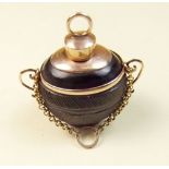 A gold mounted carved nut miniature scent bottle