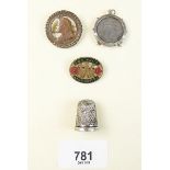 A silver thimble, WI for Home and Country badge and two coin brooches