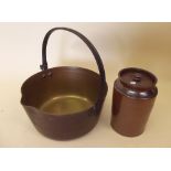 A brass preserving pan and stoneware storage jar