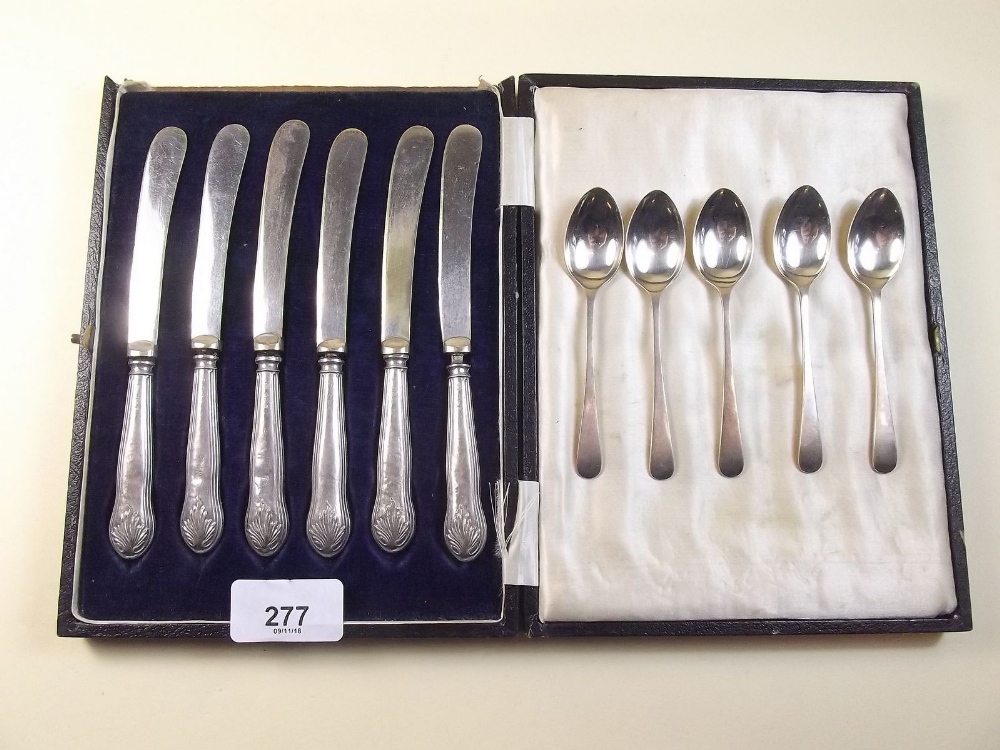 A set of six silver tea knives and a part set of five silver coffee spoons