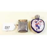 A silver vesta case and a silver topped porcelain scent bottle