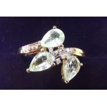 A 9 carat gold Paraiba tourmaline and diamond spray ring - size K 1/2