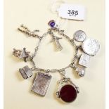 A silver charm bracelet and charms including stone set swivel fob, total weight 50g