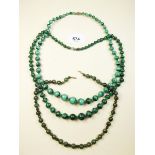 Two malachite bead necklaces and a green stone necklace