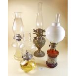 Four various oil lamps