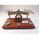 A set of brass postal scales