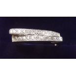 A 9 carat white gold ring off set two rows of diamonds - size M