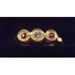 An 9 carat gold ring set diamond and red stones - size L