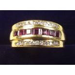 An 18 carat gold ruby and diamond ring - size Q