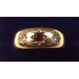 A 9 carat gold ruby and diamond gypsy ring