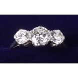 A good platinum three stone diamond ring - the central stone approx 3/4 carat - size 0