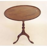 A Georgian mahogany circular tray top wine table on turned column and triple supports