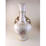 An Edwardian large vase painted flowers on an an ivory blush ground with gilt scrollwork handles,