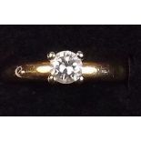 A gold solitaire diamond ring - size L