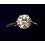 An 18 carat gold ring set solitaire champagne diamond (.95 cts) - size K