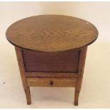 An oak needlework work table with circular occasional table top