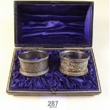 A pair of Victorian silver napkin rings, Birmingham 1894 - cased